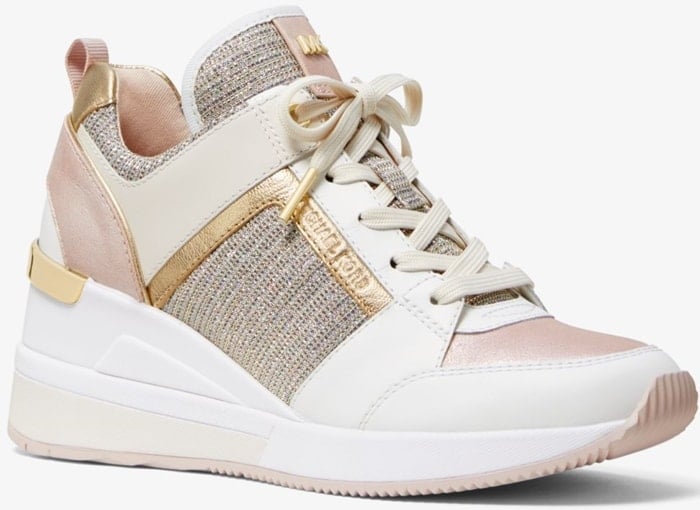 Mixed-media construction, metallic accents and a wedge heel add undeniable glamour to this sporty, street-chic sneaker