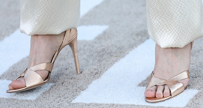 Rhea Seehorn's pretty feet in gold sandals