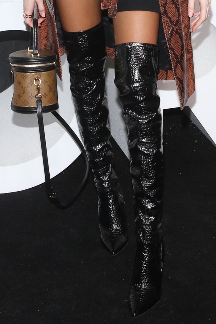 Details of Winnie Harlow's black croc-embossed thigh-high boots
