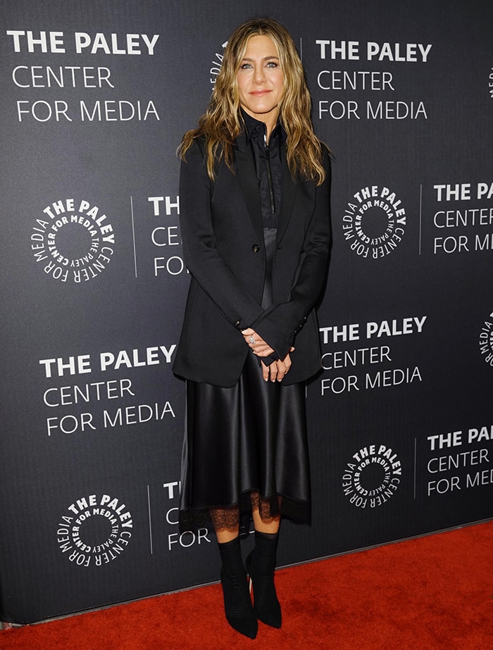 Jennifer Aniston in a bizarre black dress and long black tuxedo