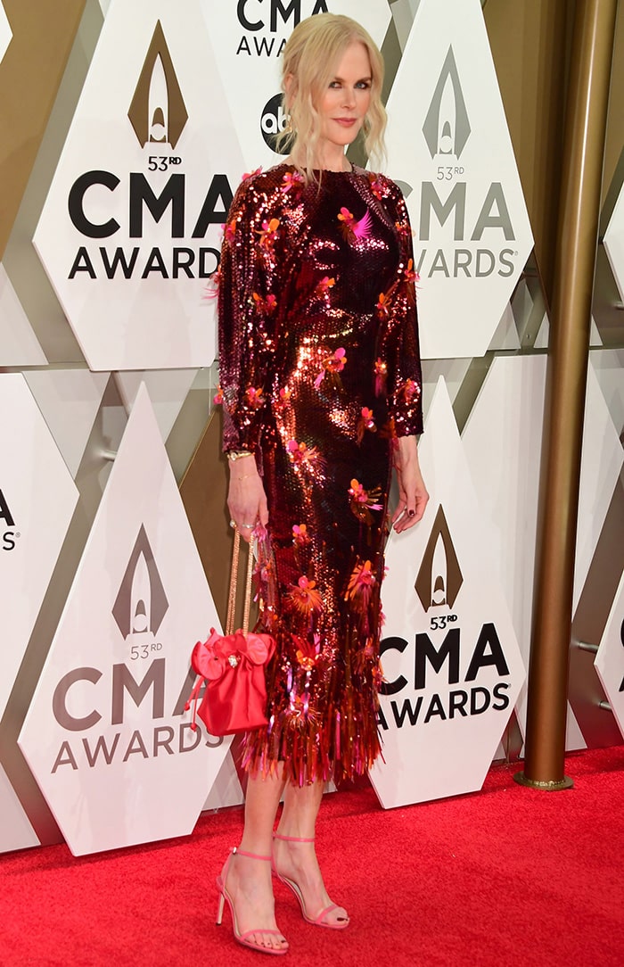 Nicole Kidman wears a red sequined Versace dress