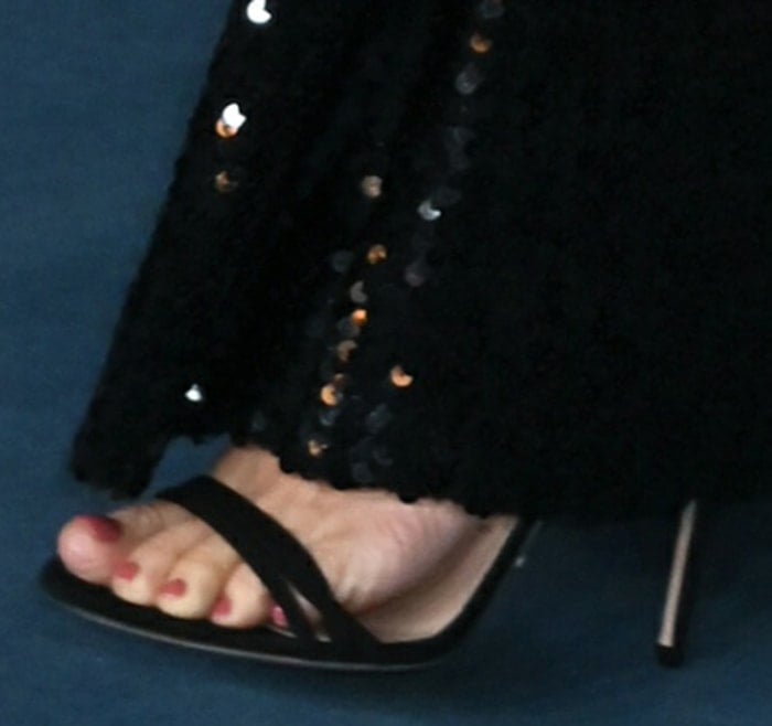 Sienna Miller shows off her red pedicure in Gucci heels