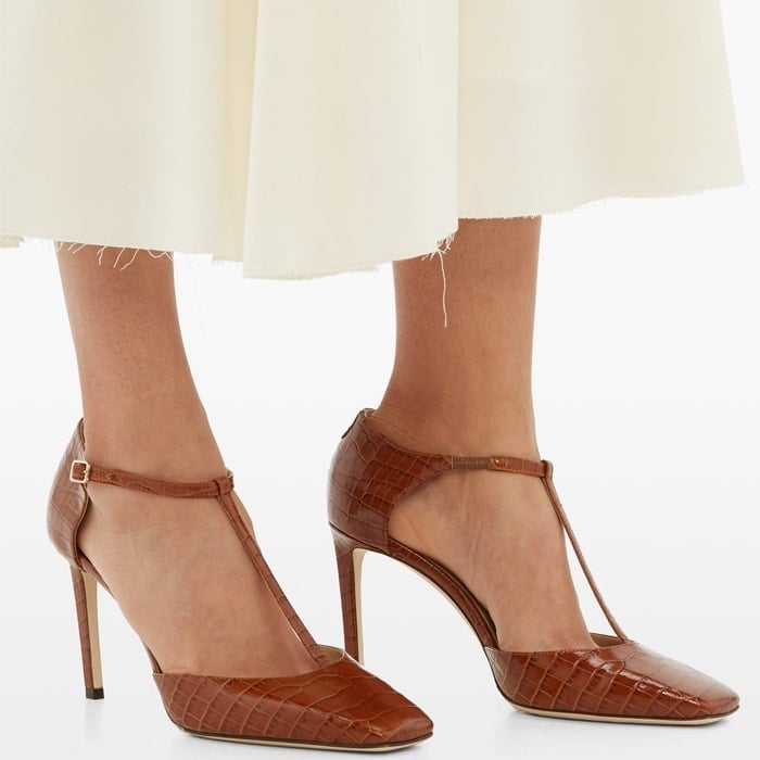 These flattering pumps are fashioned from high-shine crocodile-embossed leather in Italy with a slim stiletto heel and lined in beige leather