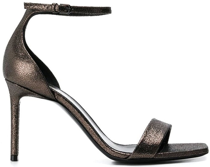 Expertly crafted in Italy from luxurious leather, these metallic Amber sandals from Saint Laurent feature a square toe, a strappy design, an ankle strap with a side buckle fastening, a branded insole and a high stiletto heel