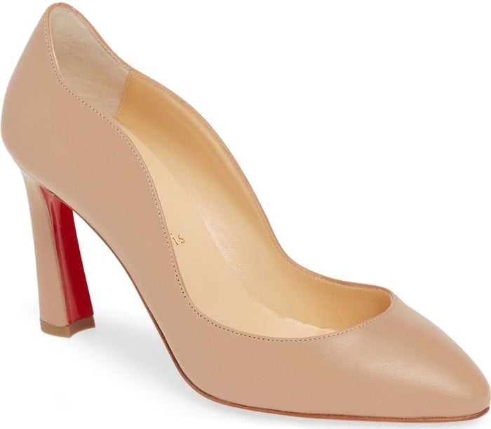 A sinuous wavy topline distinguishes an Italian-crafted pump elevated by a flared heel and finished with Christian Louboutin's iconic red sole