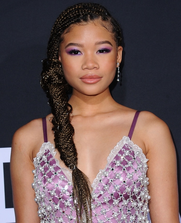 Storm Reid with gorgeous braids in a purple dress featuring pearls and crystals