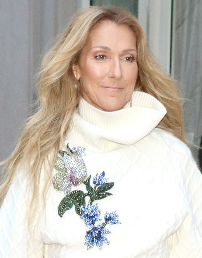 Celine Dion styled her blonde tresses in waves and wears minimal makeup