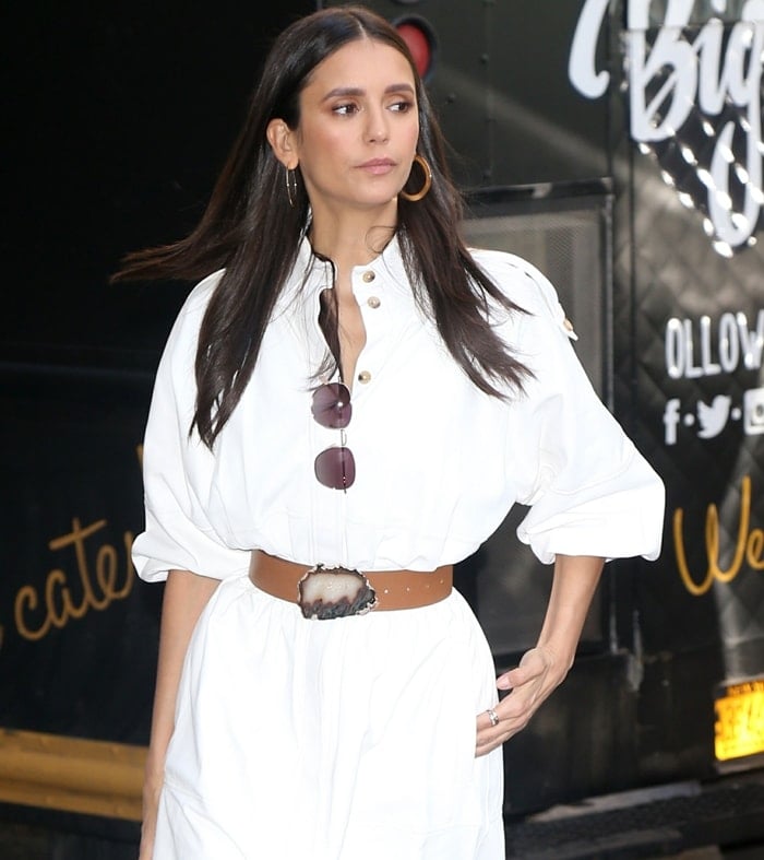 Actress Nina Dobrev wears a belted Gabriela Hearst dress inspired by the Kurdish Female Resistance