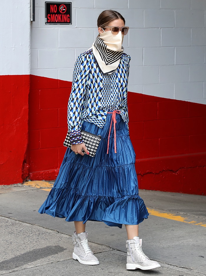 Olivia Palermo adds more pattern to her look with a black-and-white purse