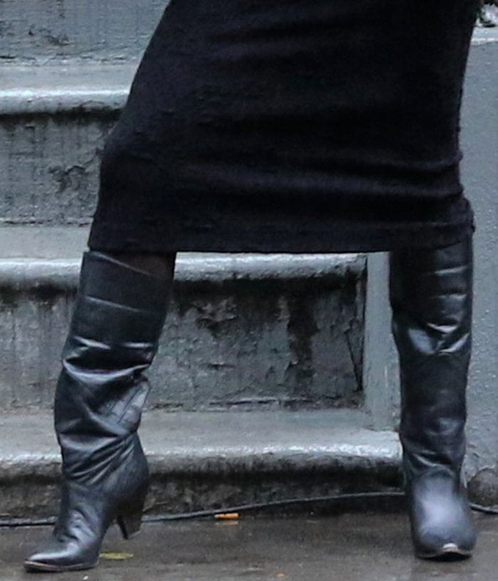 Vanessa Hudgens slips into a pair of black leather boots