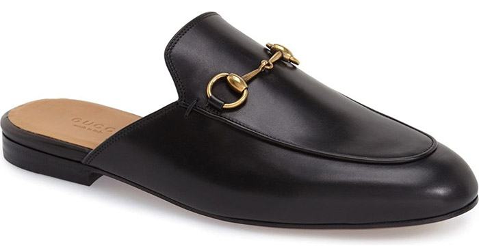 Signature goldtone horsebit hardware hearkens back to Gucci's equestrian roots on a classic loafer updated in a sleek, slip-on mule silhouette