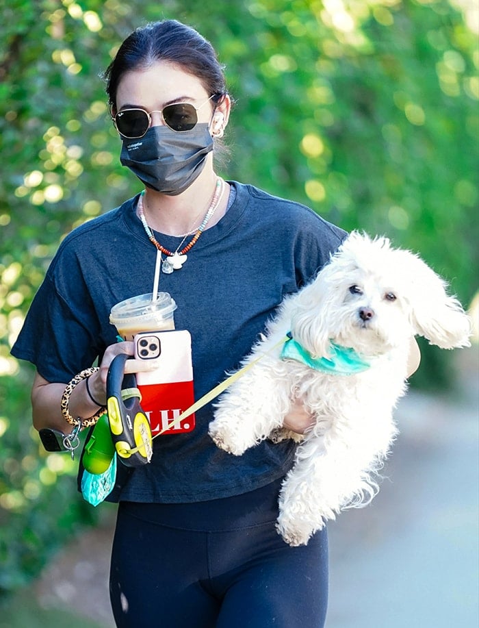 Lucy Hale keeps a low profile with Ray-Ban sunnies and stays safe with a black face mask