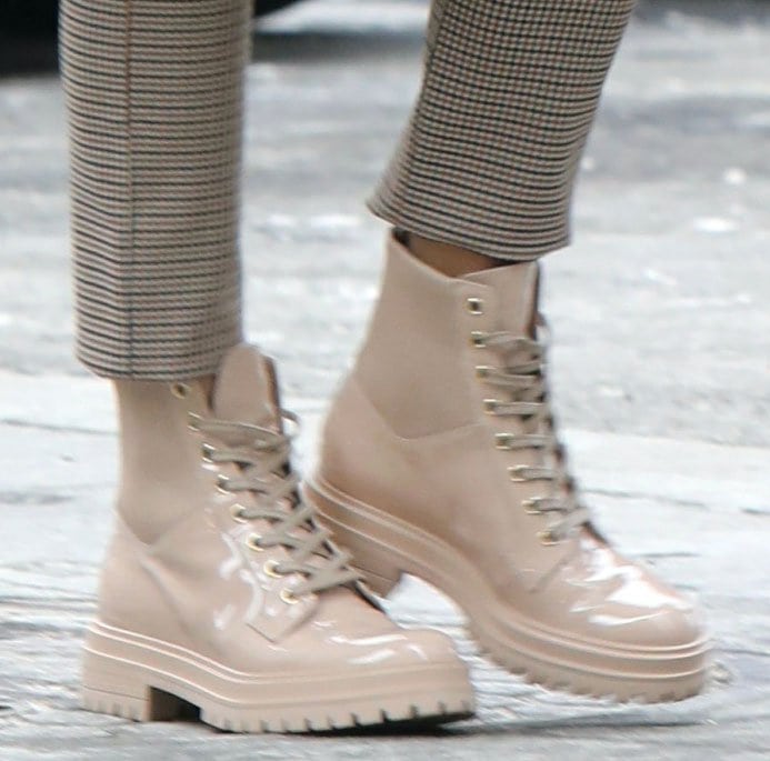 Olivia Palermo completes her stylish winter look with Gianvito Rossi beige combat boots