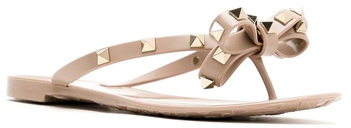 Valentino's Rubber Rockstud thong sandals blend casual comfort with luxurious embellishments, creating a versatile look suitable for any jogger style