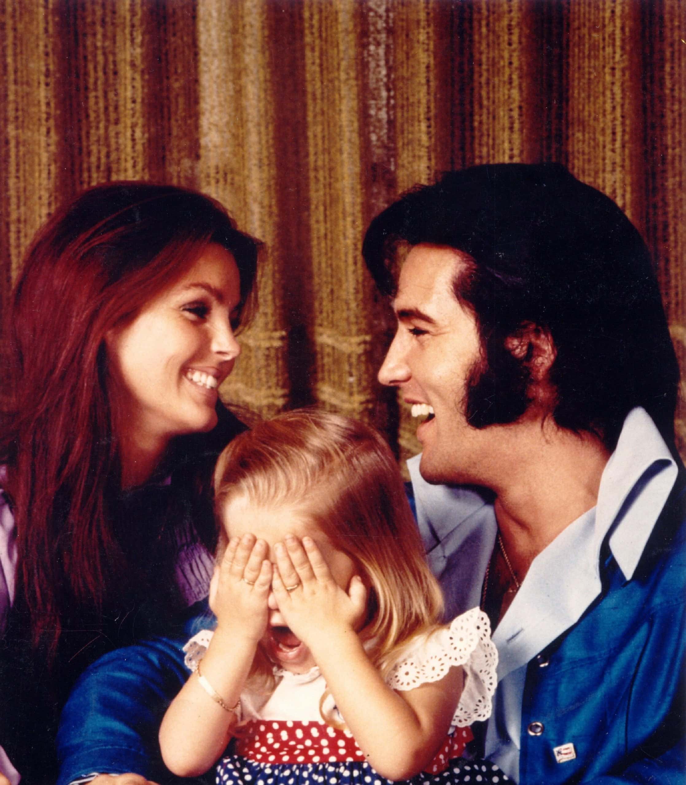 Elvis Presley, Priscilla Presley, and their daughter Lisa Marie Presley in 1971