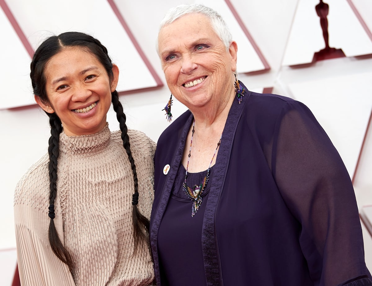 Nomadland real-life star Charlene Swankie posing with Chinese filmmaker Chloé Zhao