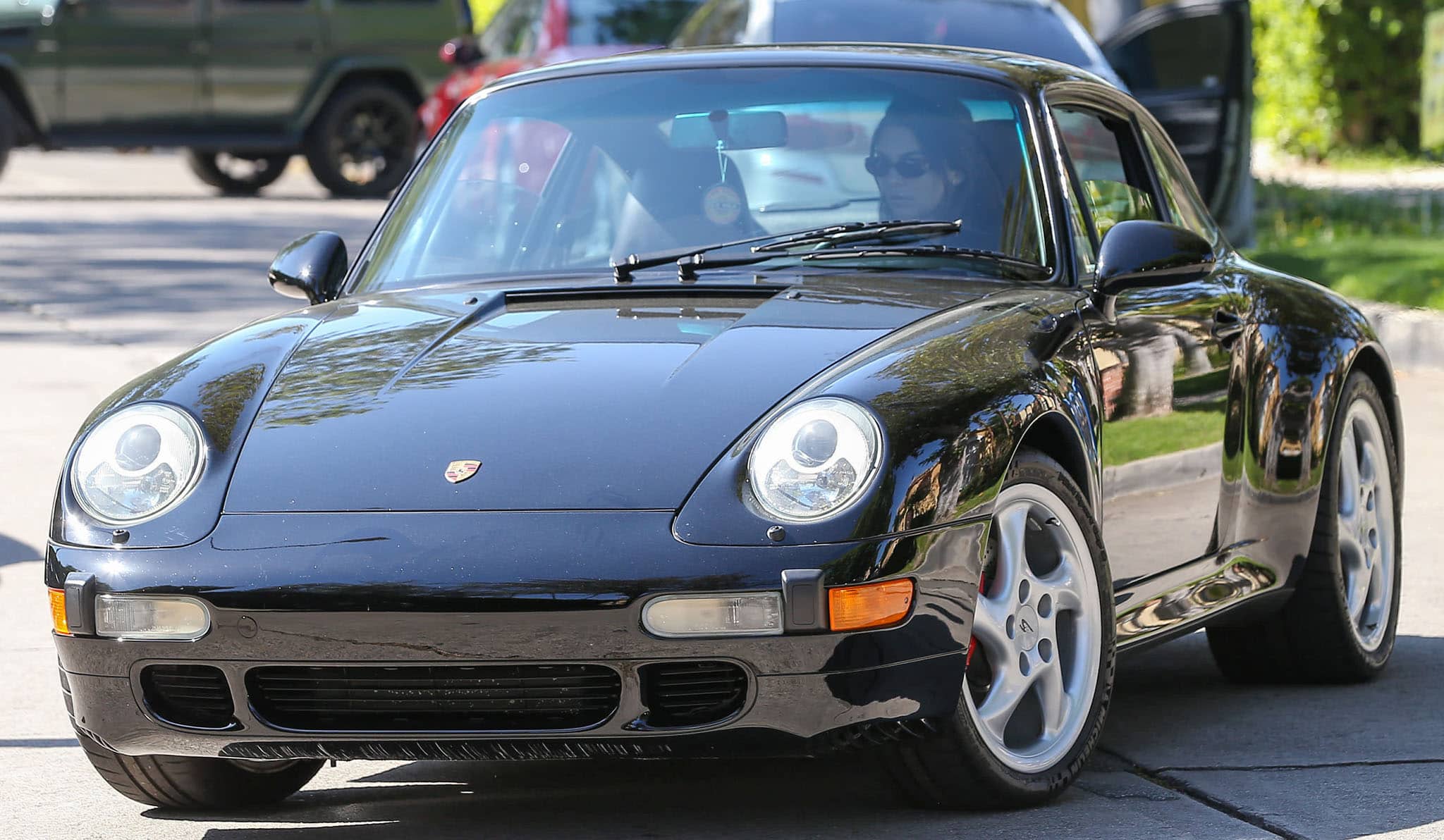 Kendall Jenner arrives at Forma Pilates studio in a black Porsche