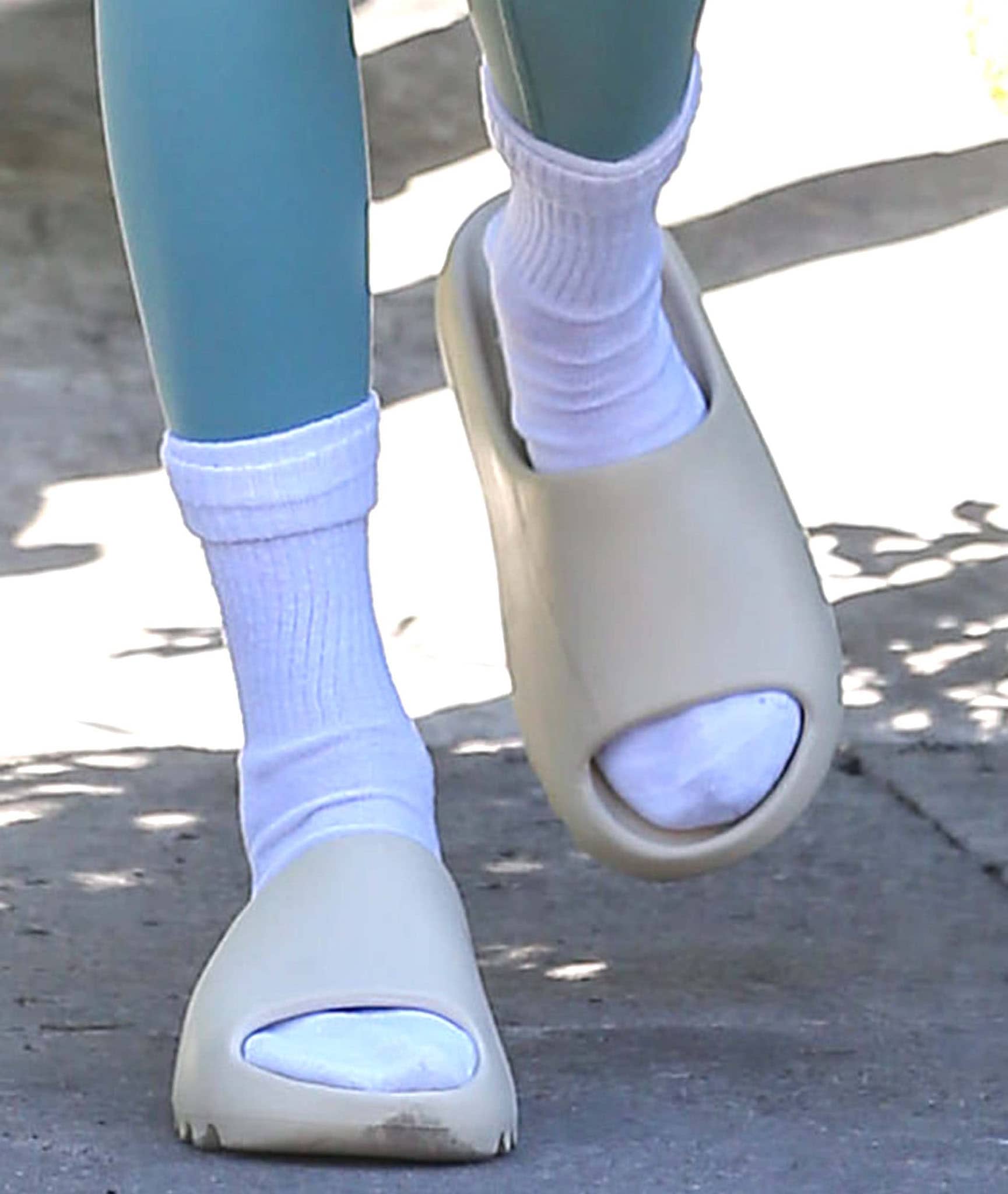 Kendall Jenner Wears Disputed Socks & Yeezy Slides in Leggings & Skims –  Footwear News