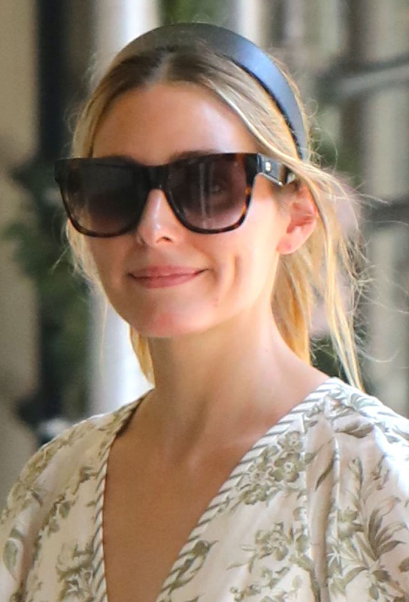 Olivia Palermo keeps her look girly with a ponytail and a thick headband