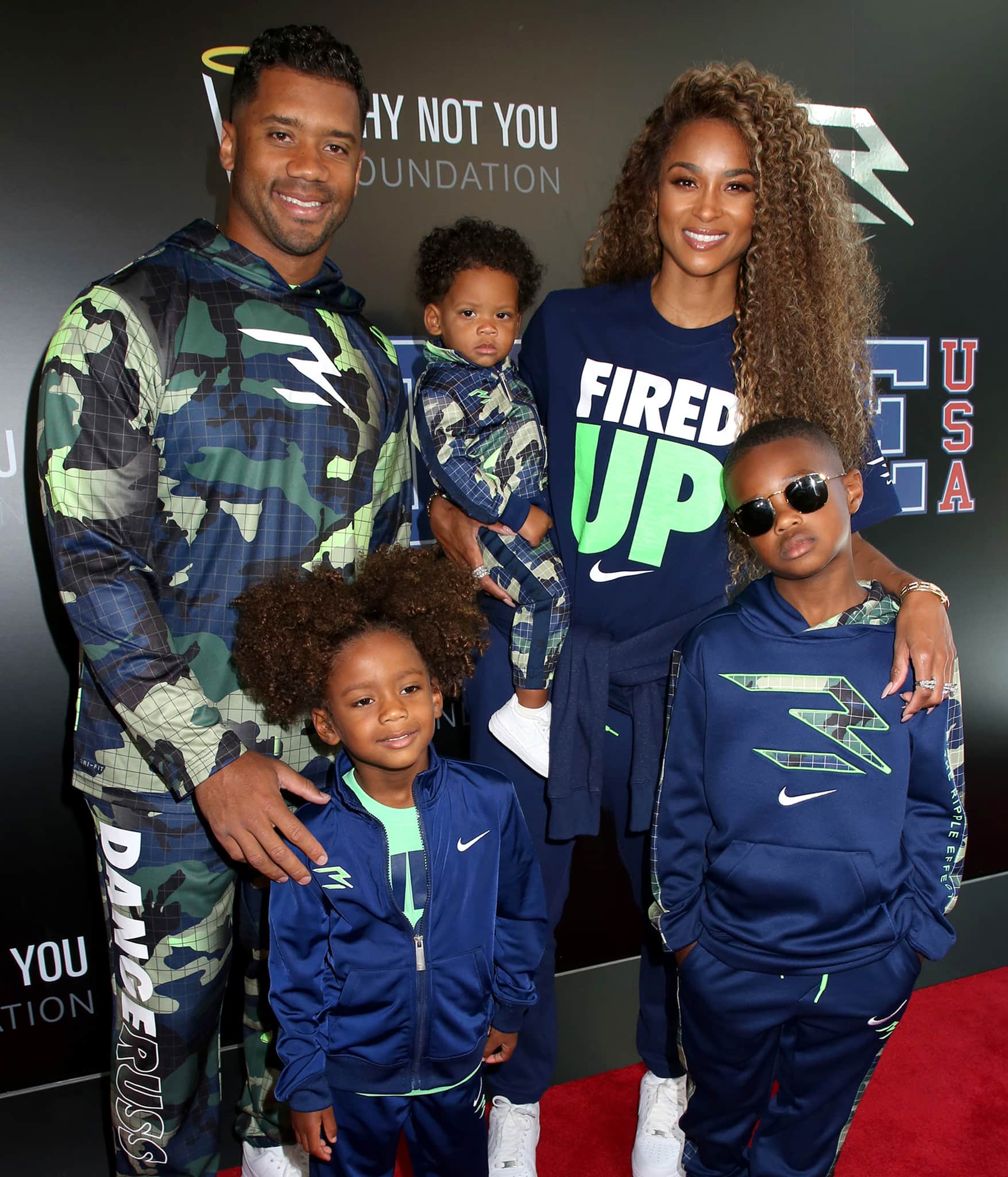 Ciara and her kids wear matching blue and green outfits from the 3BRAND collection