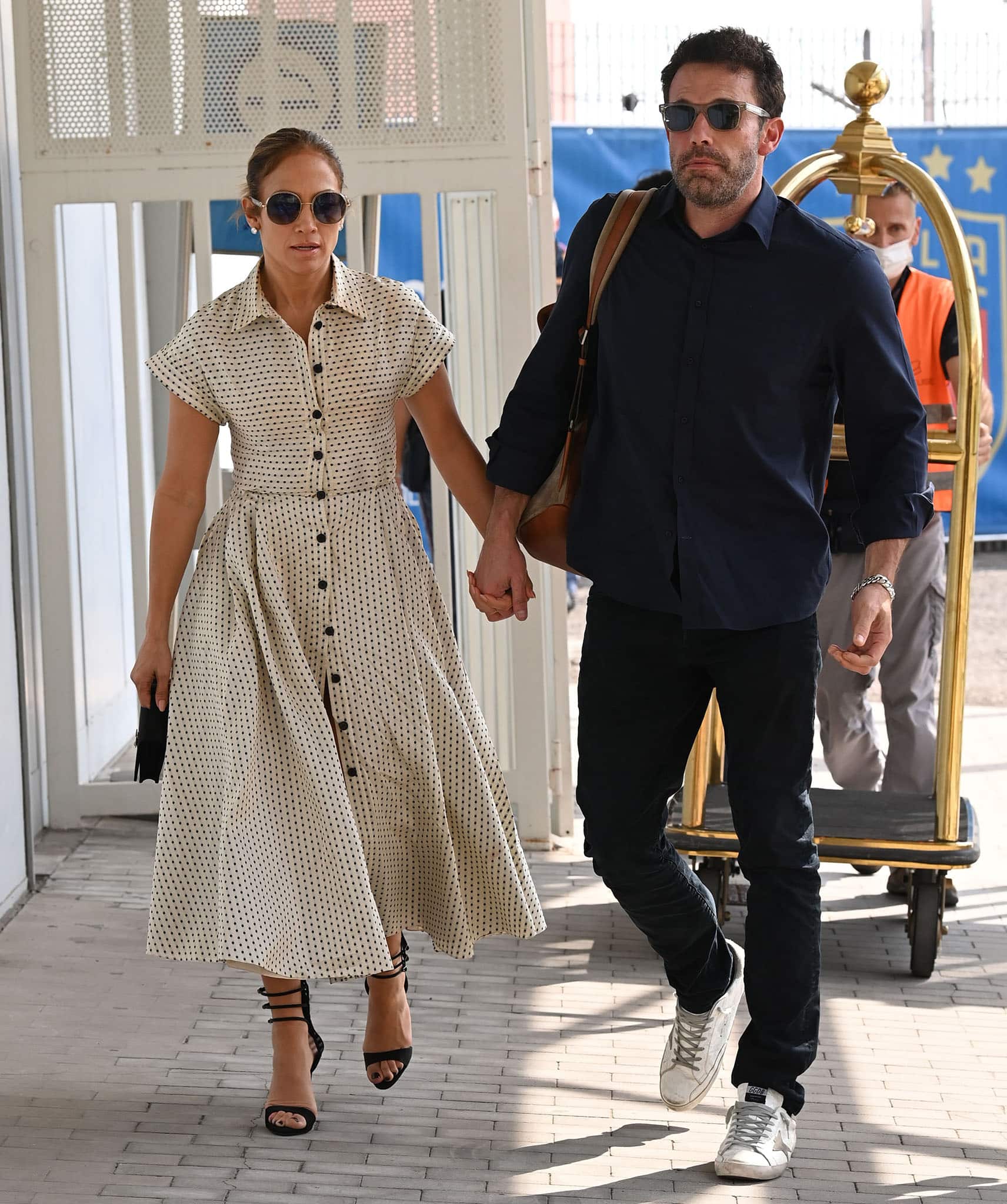 Jennifer Lopez and Ben Affleck holding hands at the Venice Marco Polo Airport on September 11, 2021