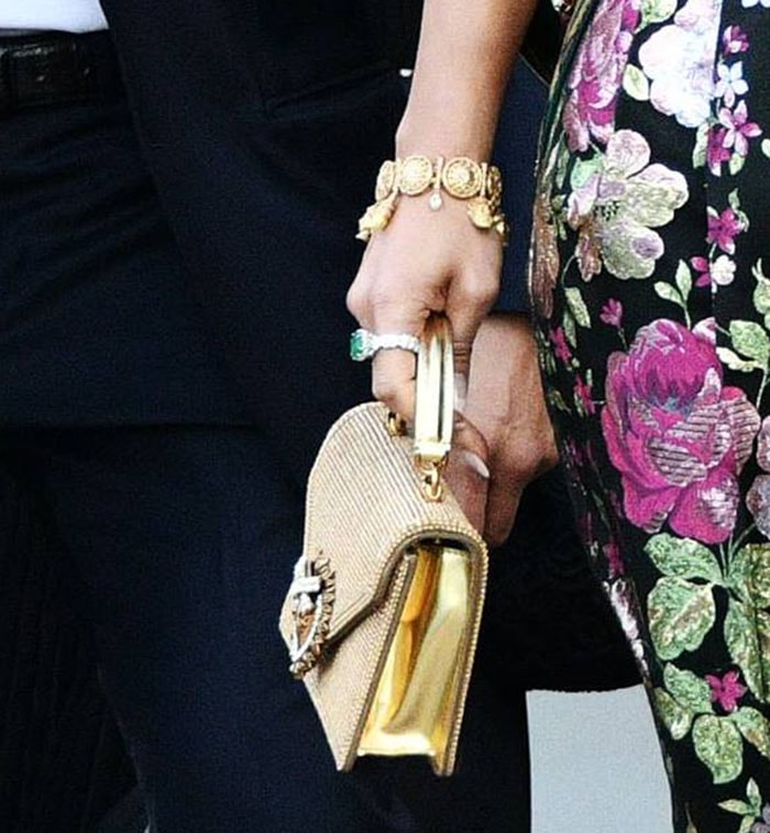 Jennifer Lopez carries a gold crystal-embellished Dolce & Gabbana mini Devotion bag