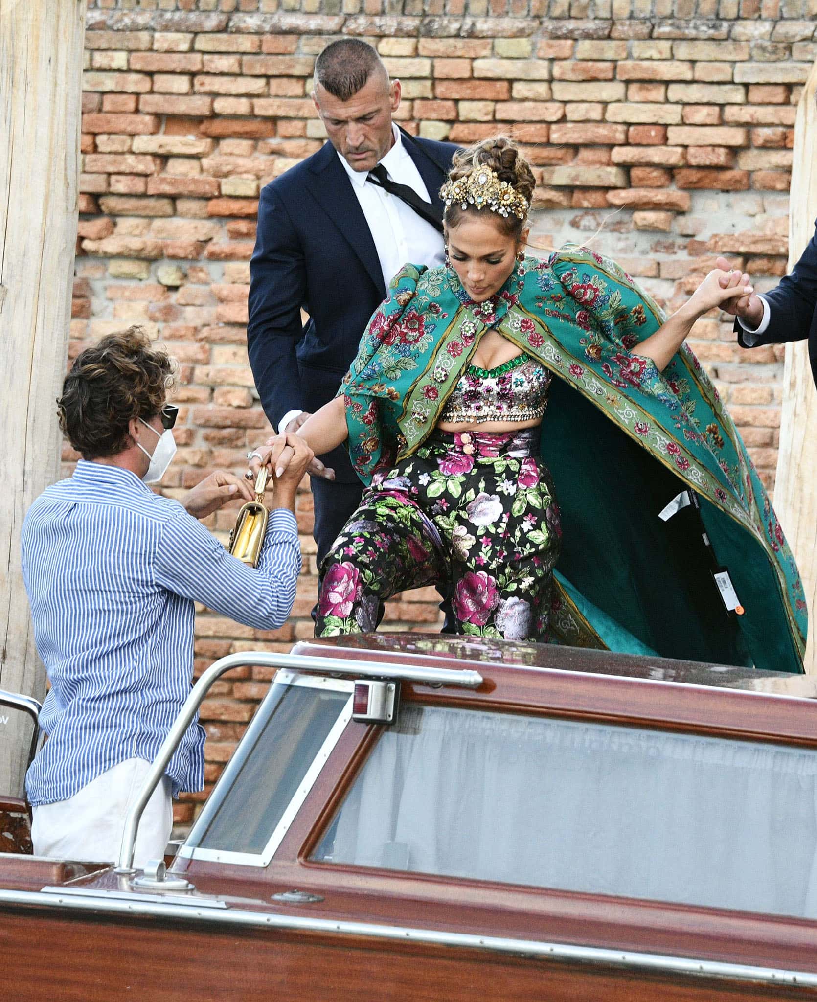 Jennifer Lopez accidentally leaves the price tag on her Dolce & Gabbana pelisse cape