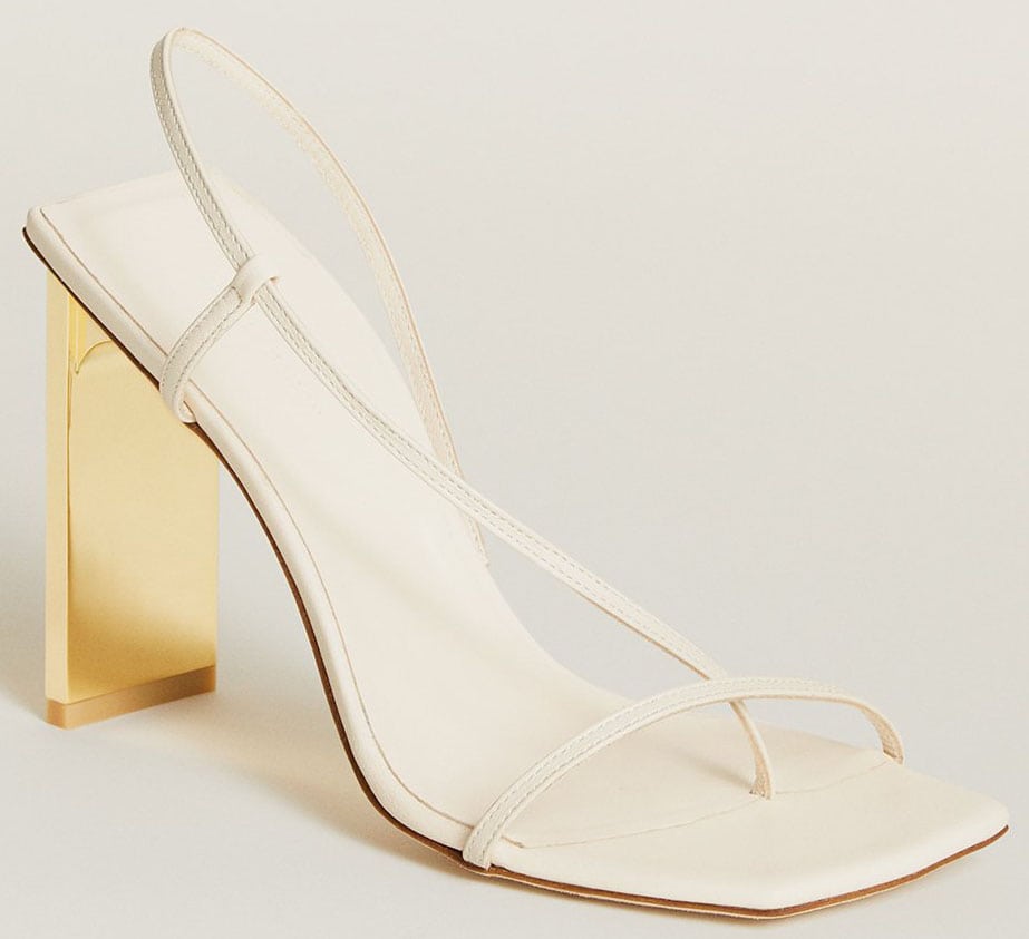 The Arielle Baron Narcissus sandals have trendy square toes, delicate asymmetric slingback straps, and gold mirror heels