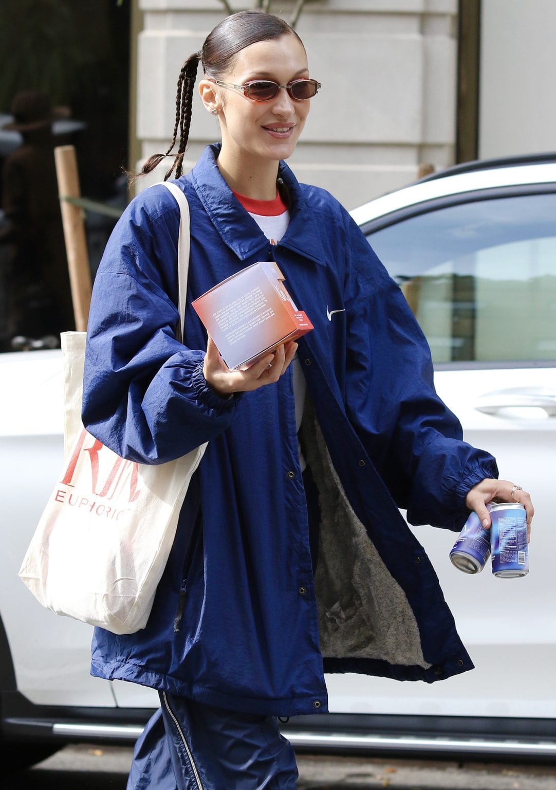 Kin Euphorics Co-Founder Bella Hadid Hands Drinks to Photographers in ...