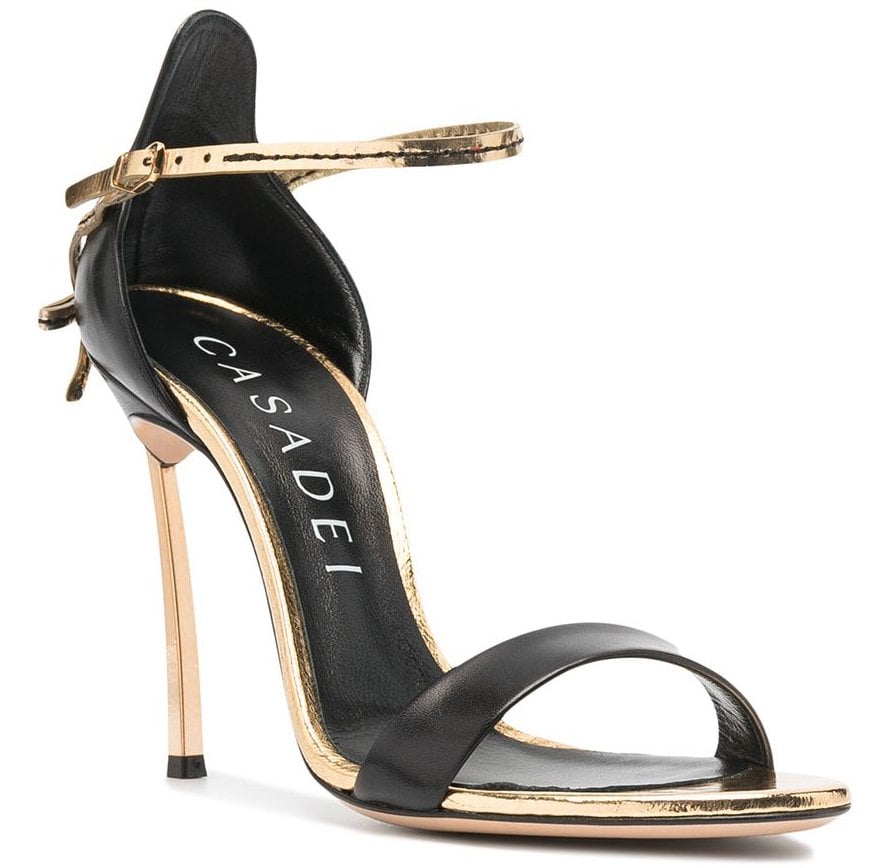 A sleek addition to any outfit, Casadei's Blade Penny features black leather counters and toe straps and metallic gold leather trims