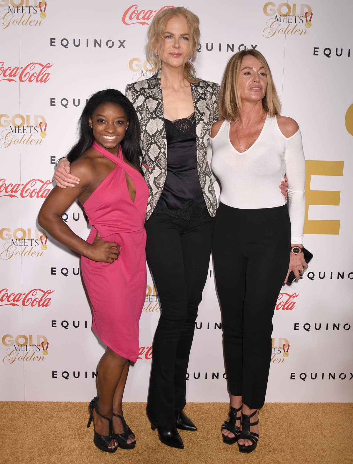 Olympic athlete Simone Biles, actress Nicole Kidman, and Olympic athlete Nadia Comaneci attend the Life is Good at GOLD MEETS GOLDEN Event at Equinox on January 7, 2017, in Los Angeles, California