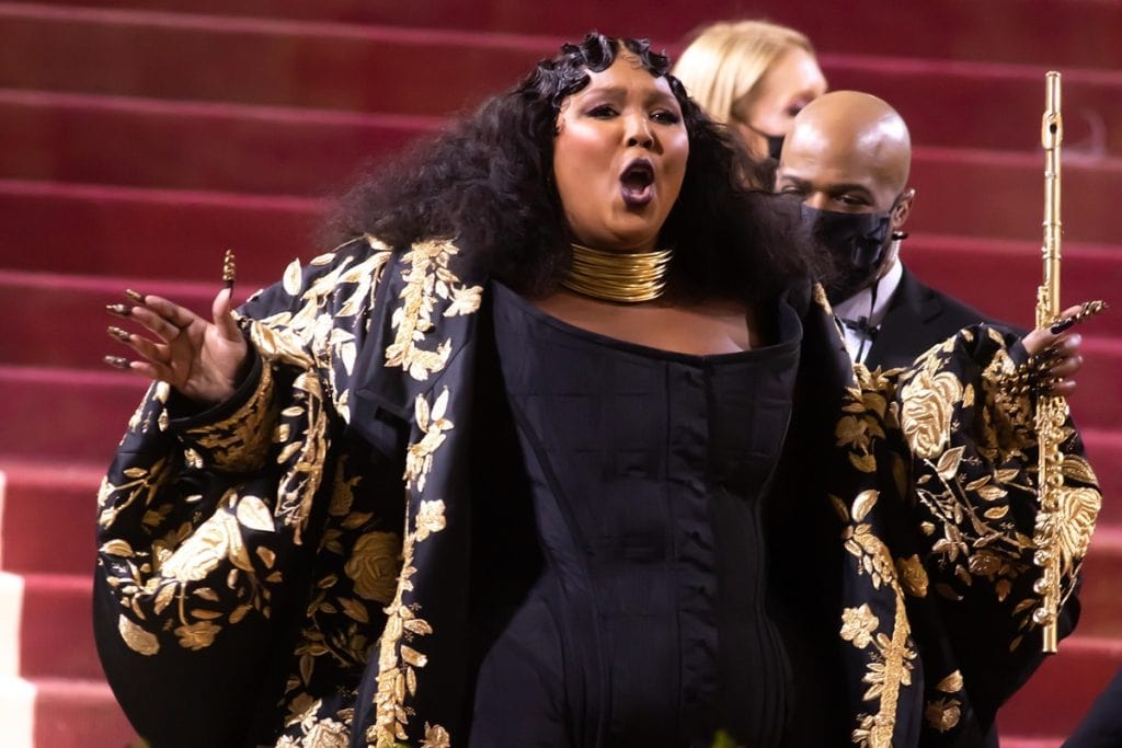 Lizzo Plays Gold John Lunn Flute on Met Red Carpet