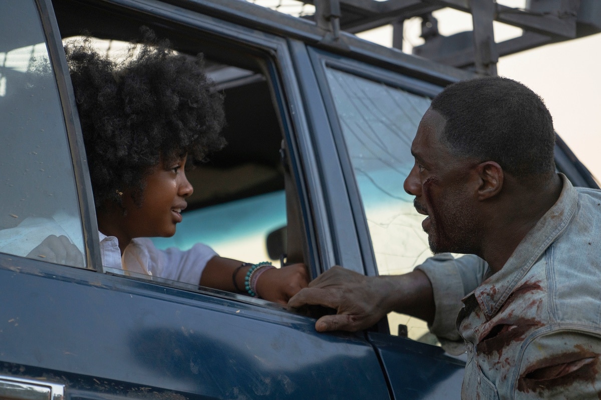 Leah Jeffries as Norah Samuels and Idris Elba as Dr. Nate Samuels in Beast