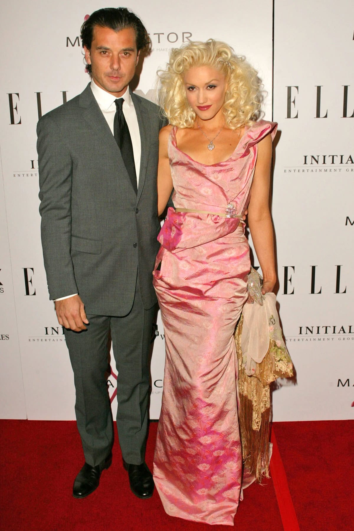 Gwen Stefani stuns in a vintage-inspired pink gown alongside Gavin Rossdale at the premiere of The Aviator