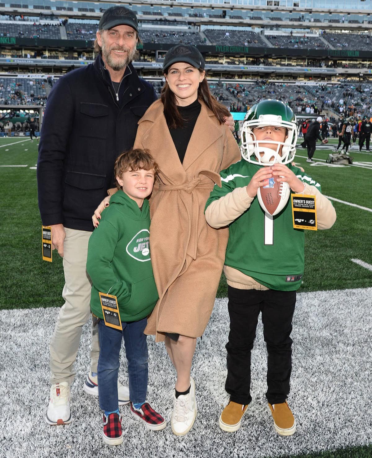 Alexandra Daddario shares a heartwarming moment with her husband, Andrew Form, and his two sons, Rowan and Julian, at the New England Patriots vs. the New York Jets game at Met Life Stadium on September 19, 2024 in East Rutherford, New Jersey