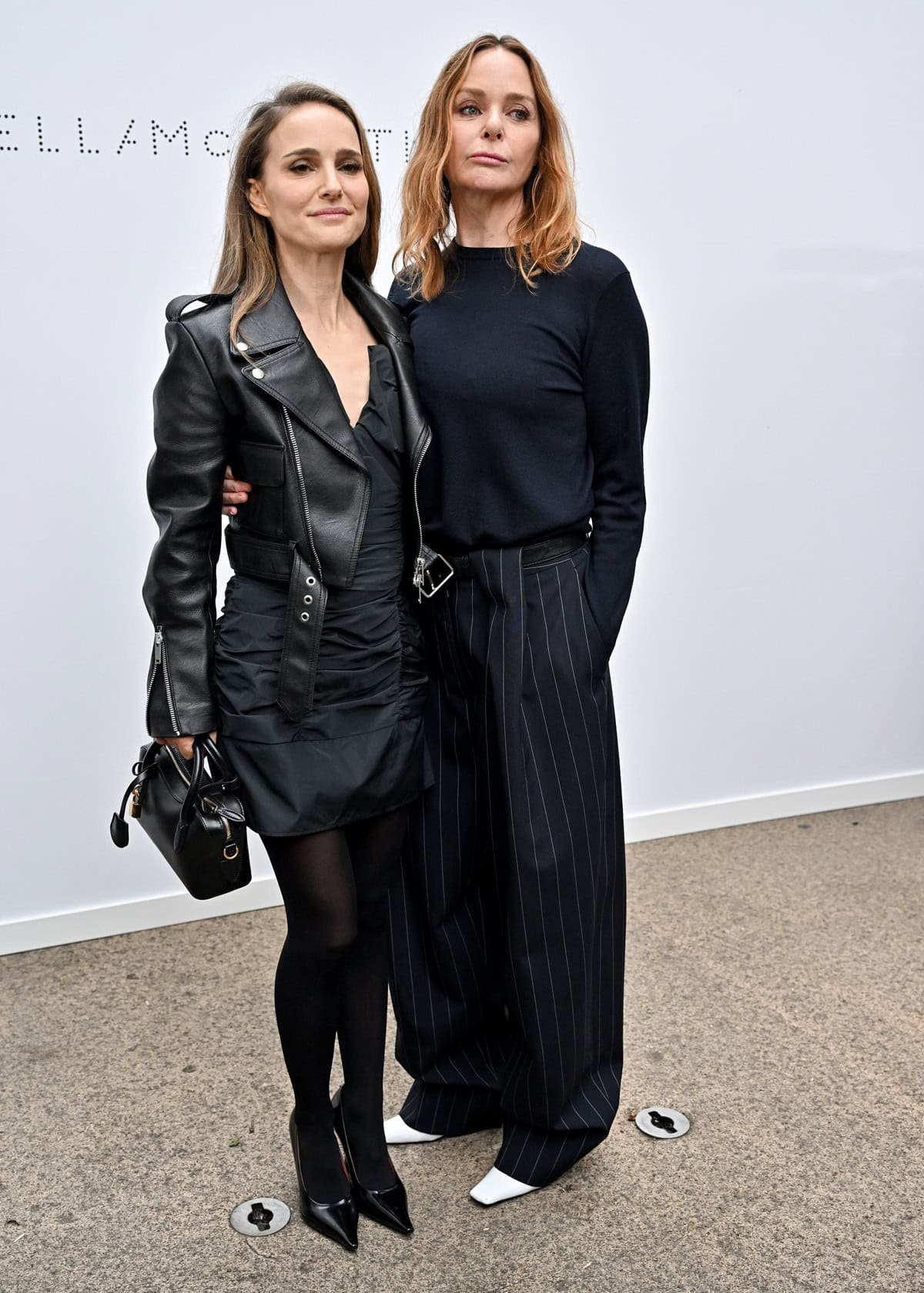 Natalie Portman and Stella McCartney pose in chic ensembles at the Stella McCartney Spring/Summer 2025 show during Paris Fashion Week