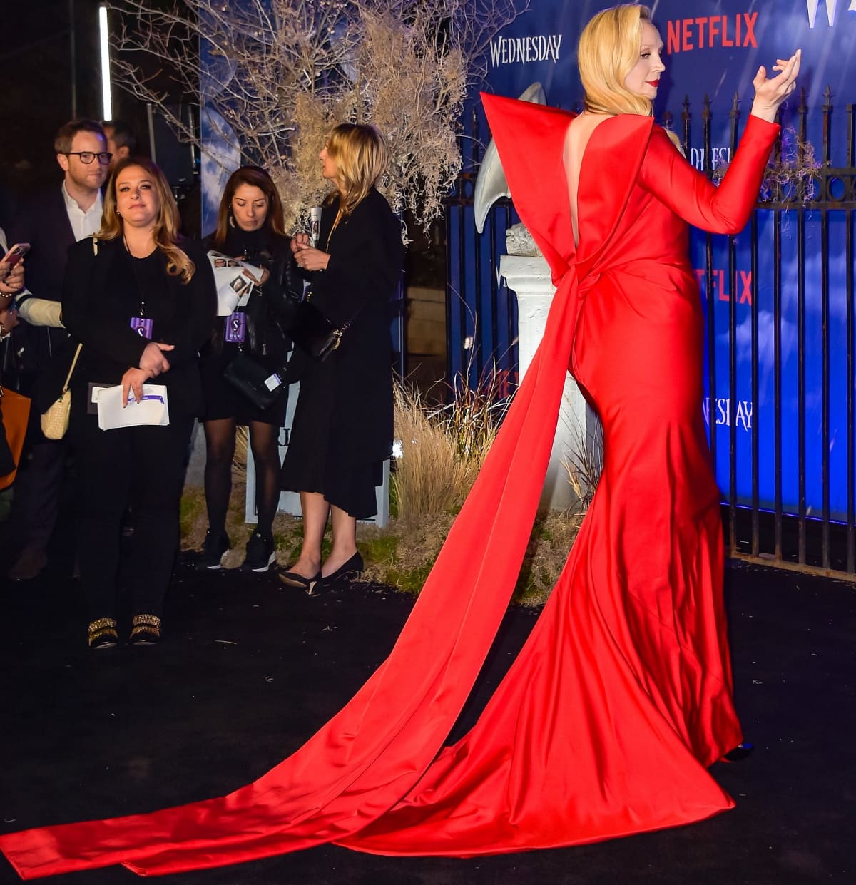 Gwendoline Christie striking a pose to show her off the sculptural detail of her gown