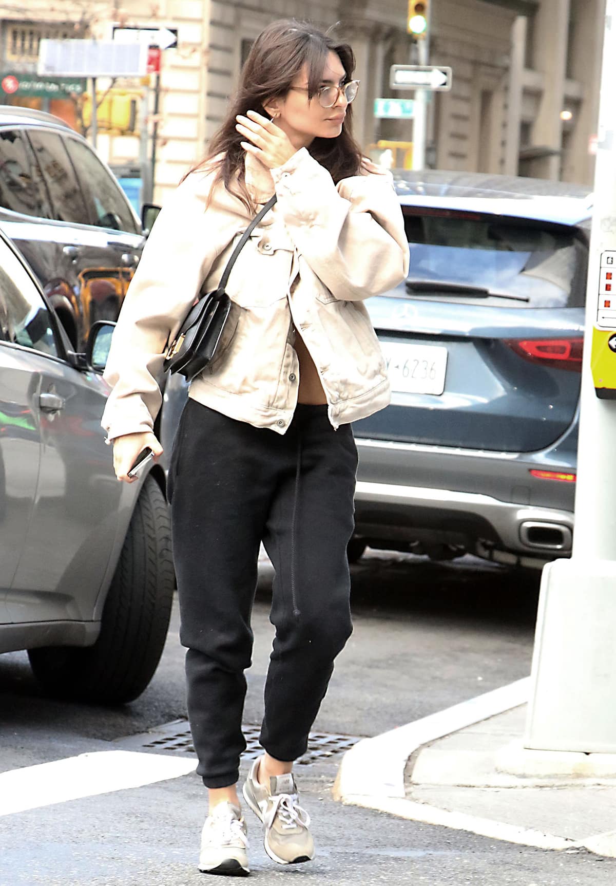 Emily Ratajkowski heads to Sony Entertainment Building in Yeezy jacket and New Balance shoes for her weekly podcast High Low with Emrata on January 18, 2023