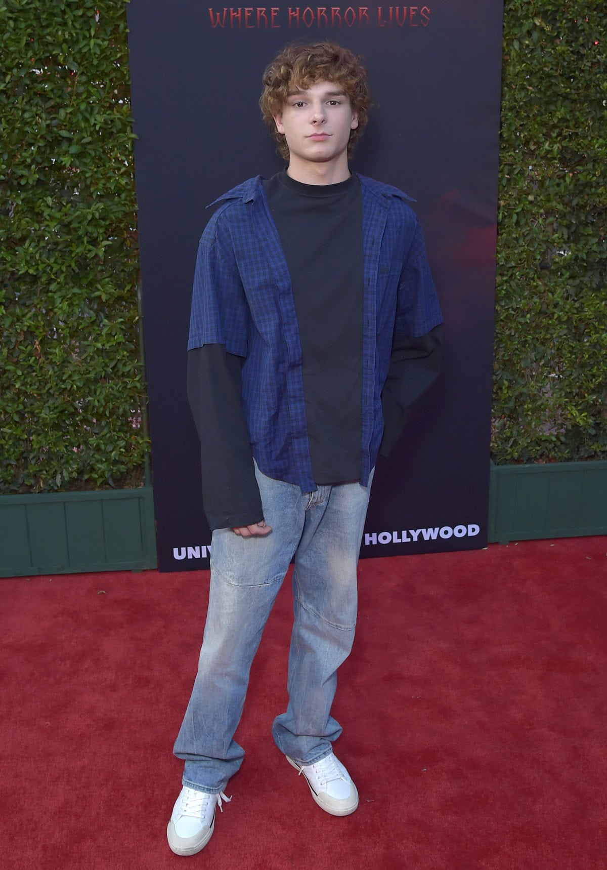 Mason Thames showcasing his casual red carpet style at the opening night celebration of Halloween Horror Nights