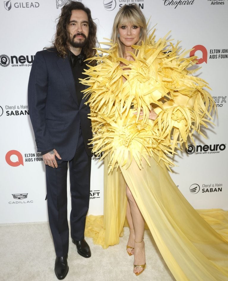 Heidi Klum Makes Grand Entrance in Yellow Feathered Dress at Elton John ...