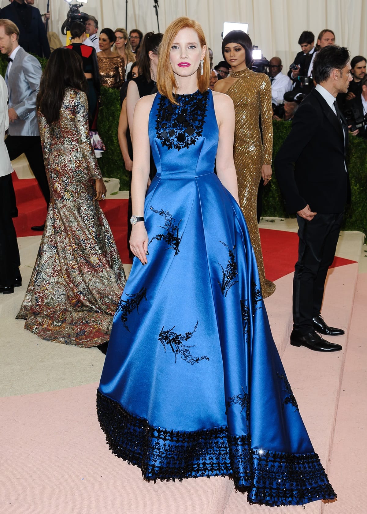 Jessica Chastain wearing a beautiful peacock blue silk gabardine gown designed by Prada at the "Manus x Machina: Fashion In An Age Of Technology" Costume Institute Gala