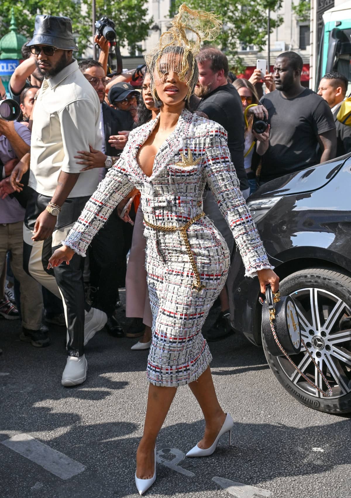 Cardi B slipped into a pair of pointed-toe white heels to complete her ensemble