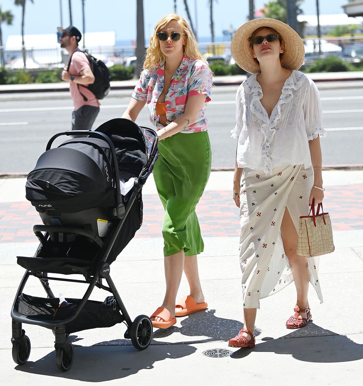 Rumer Willis is joined by her sister Tallulah by the beach both clad in breezy summer outfits