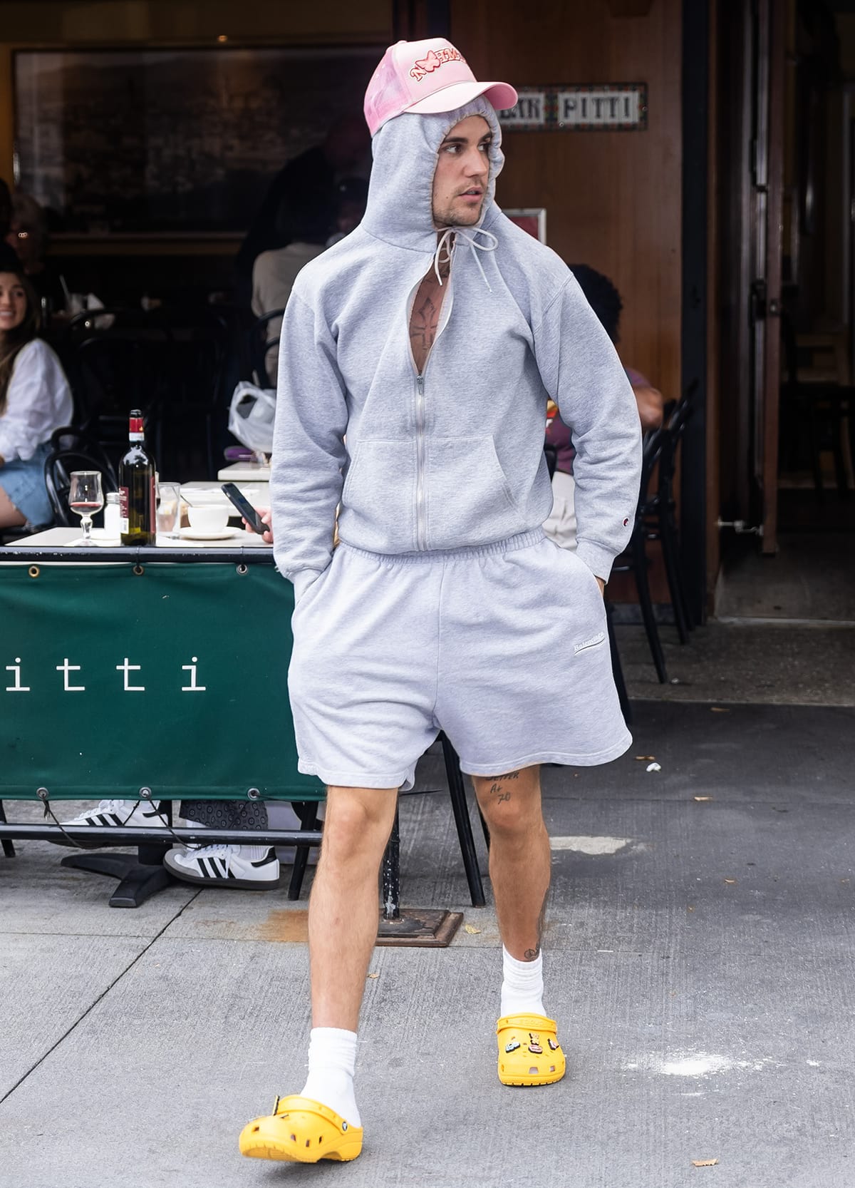 Justin Bieber accompanies Hailey Bieber to Krispy Kreme in gray sweats and yellow Crocs