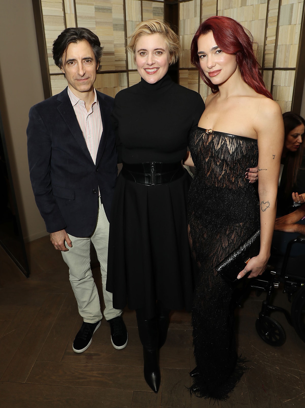 Dua Lipa poses with Barbie director Greta Gerwig and her husband Noah Baumbach