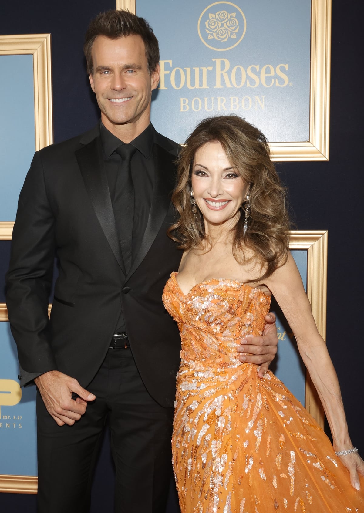 Reunion on the red carpet: 5ft 1in (155 cm) tall Susan Lucci shares a smile with her towering 6ft 2in (188 cm) former 'All My Children' co-star Cameron Mathison, at the Emmy Awards