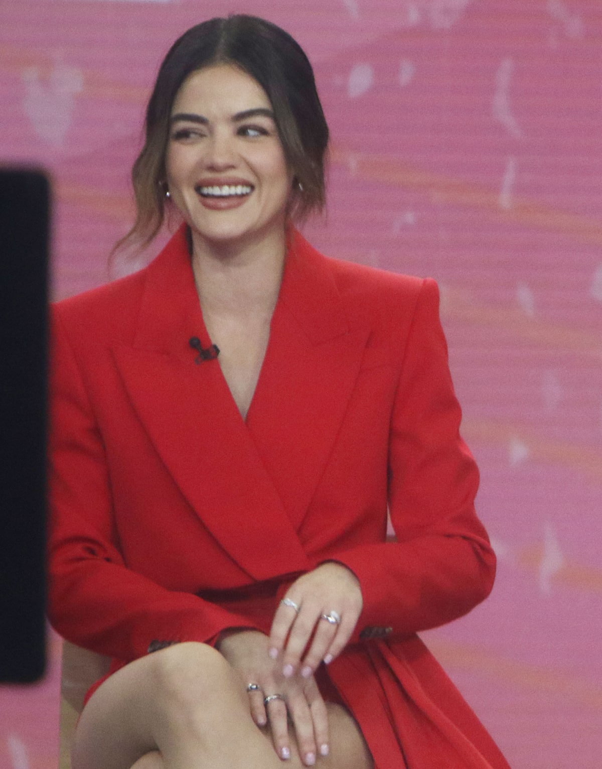 Lucy Hale embraces the season's red trend in a red Alexander McQueen crop tuxedo jacket and matching shorts