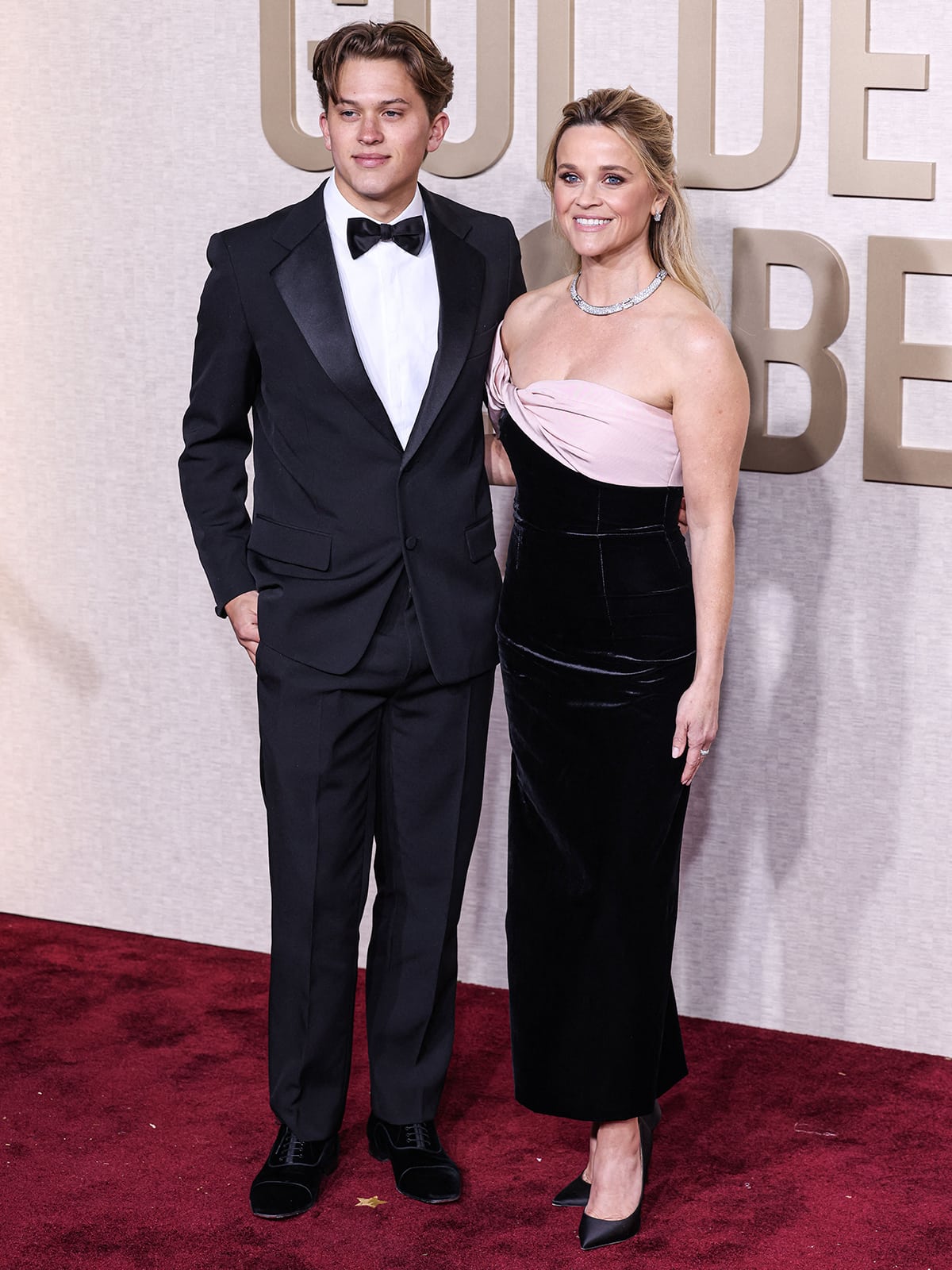 Reese Witherspoon is joined by her son Deacon on the red carpet at the 81st Annual Golden Globe Awards