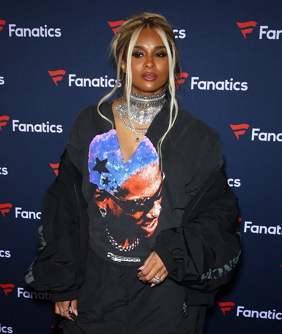 Ciara wears her two-tone tresses in a messy updo and glams up with smokey eyeshadow and diamond necklaces