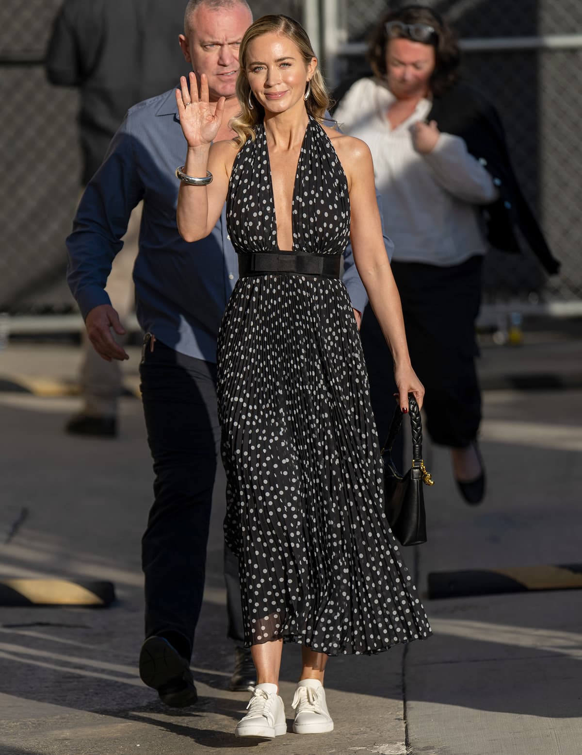 Emily Blunt wows in a plunging polka-dot dress by Dolce & Gabbana ahead of her appearance on Jimmy Kimmel Live on February 23, 2024